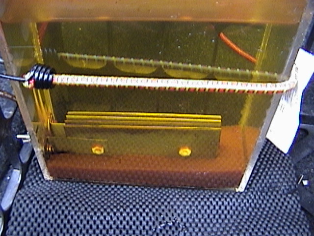 Morning after use of cell. Typical by product is iron corrosion from stainless steel plates.