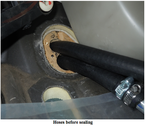 11. hoses thru plywood plate, not sealed.png