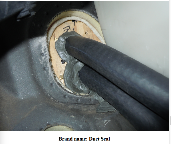 12. hoses through plywood plate, w Duct Seal.png
