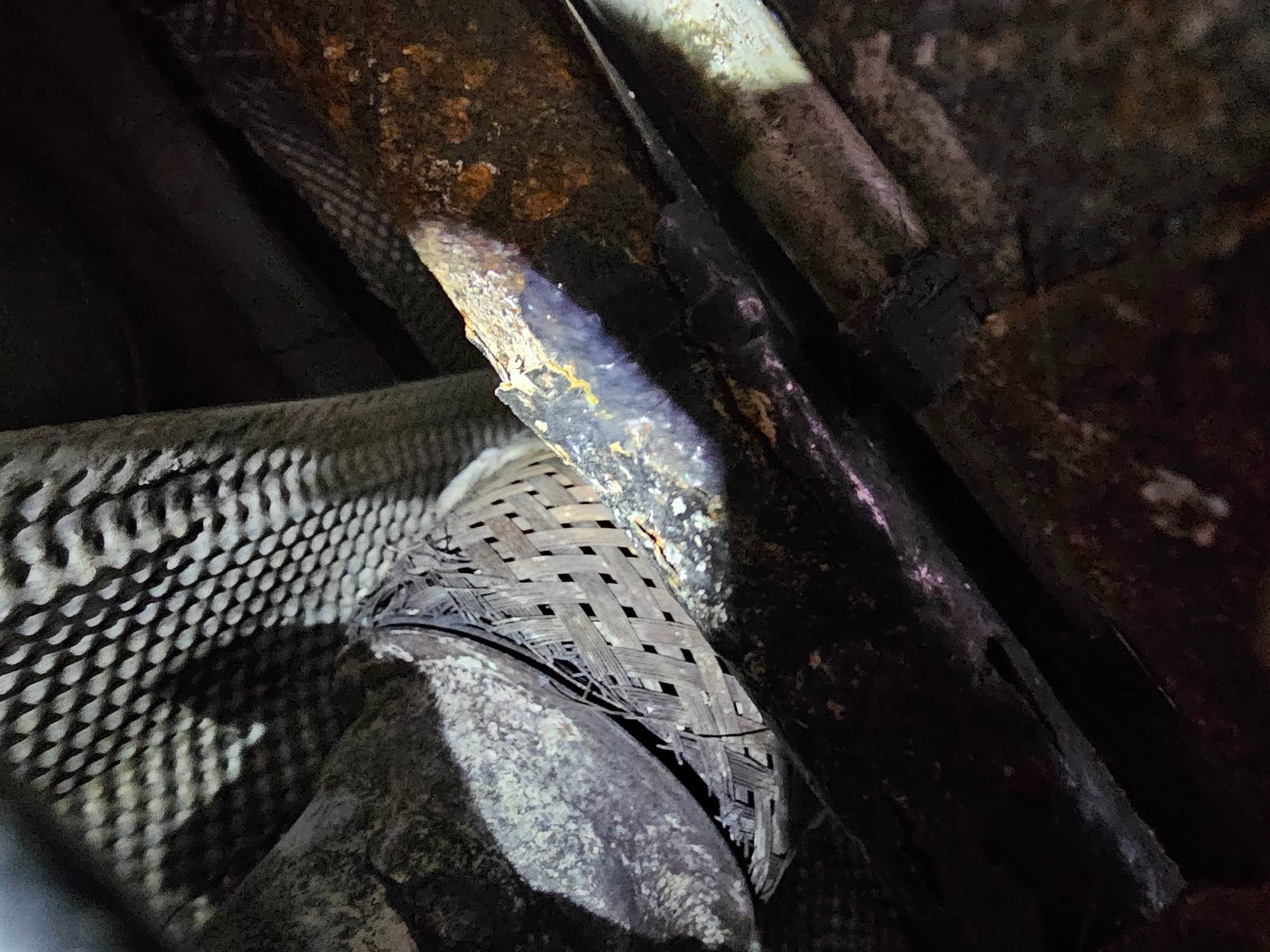 exhaust leak under frayed fibers at at flex-cat junction