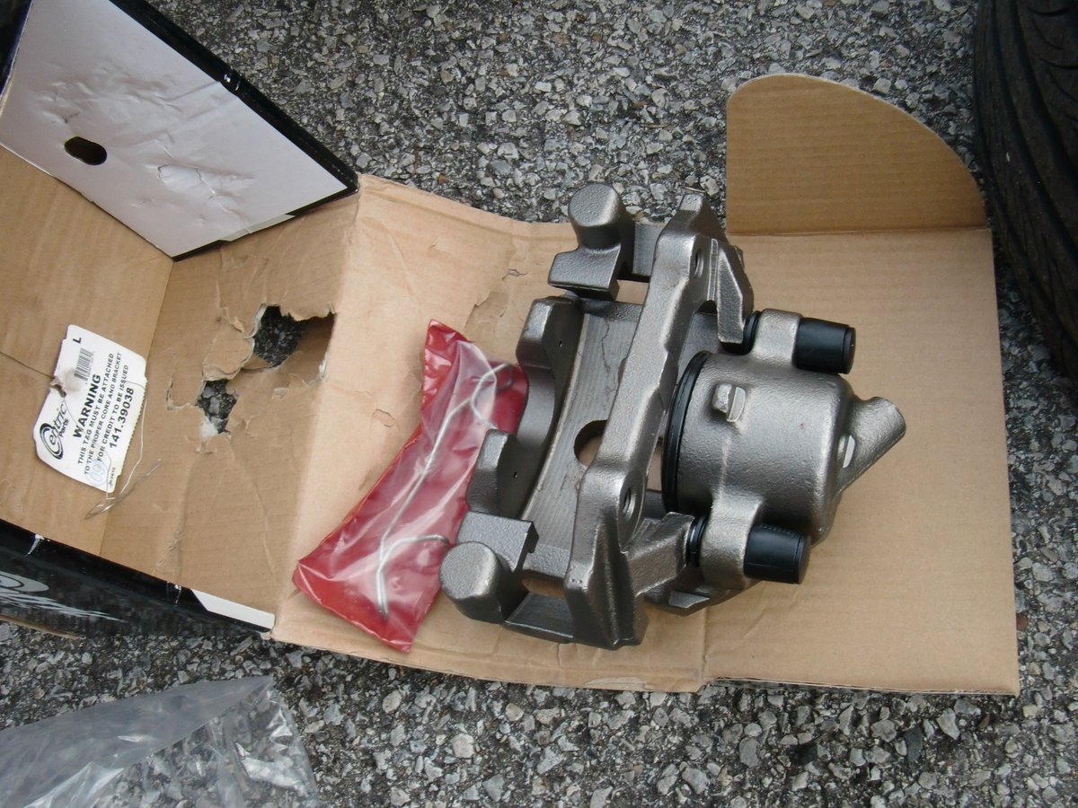 New/rebuilt caliper on its box