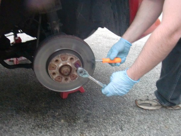 Here's how to hold the rotor while you break loose the locator pin