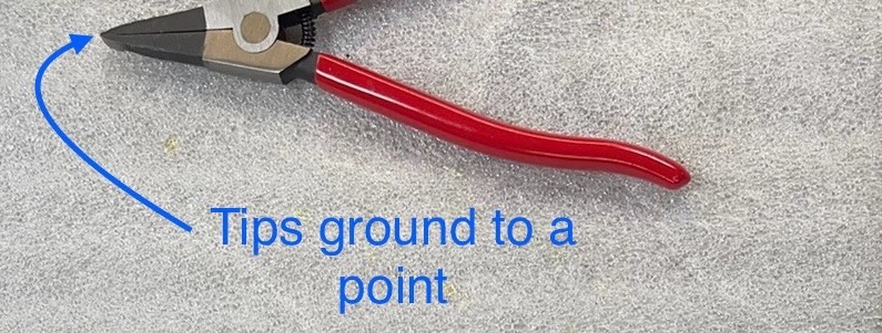 Piston ring pliers with tips ground to a point
