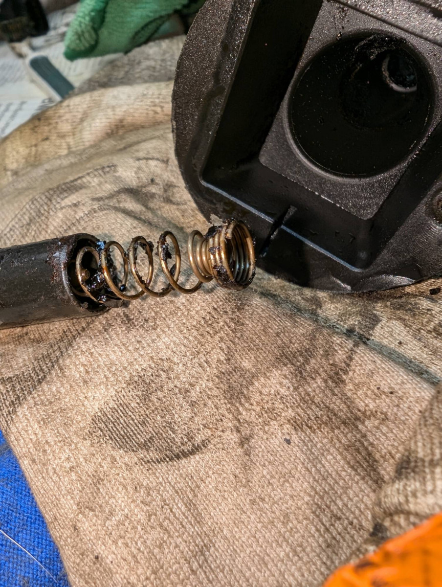 Oil coated electrical contact on coil