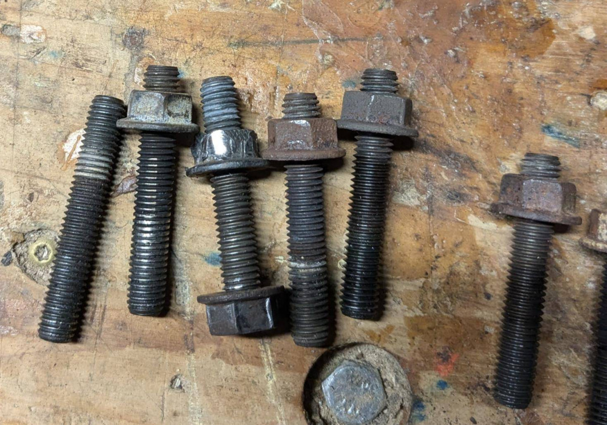 Old exhaust manifold studs with bound/galled nuts and damage to threads