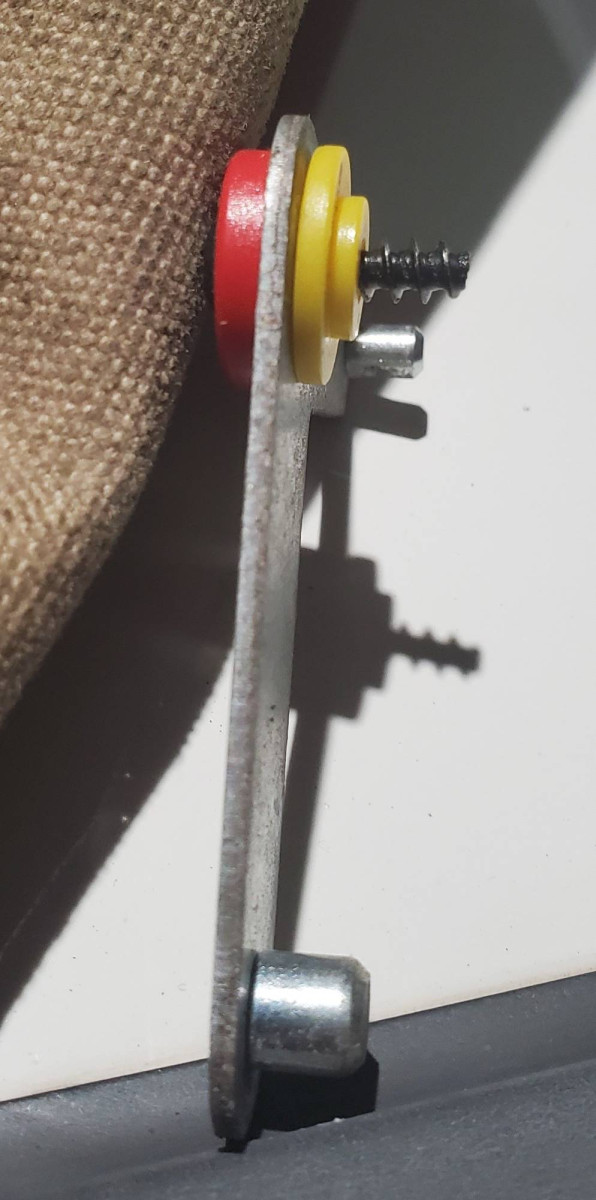 If you need to re-assemble lever arm, yellow washer goes between case and arm, then red washer goes between screw and arm.