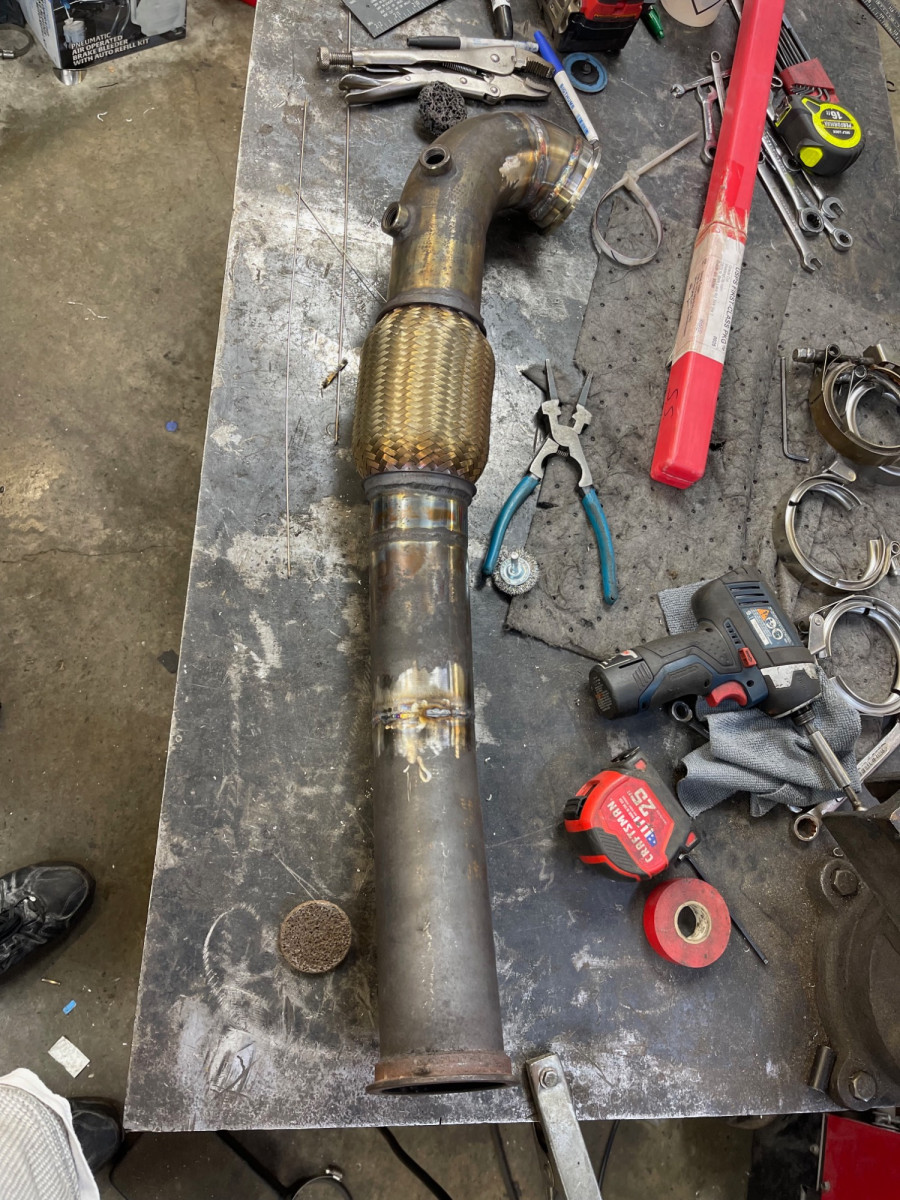 had to cut and modify the tail of the downpipe as well to compensate for the new bend in the neck exiting the turbine housing