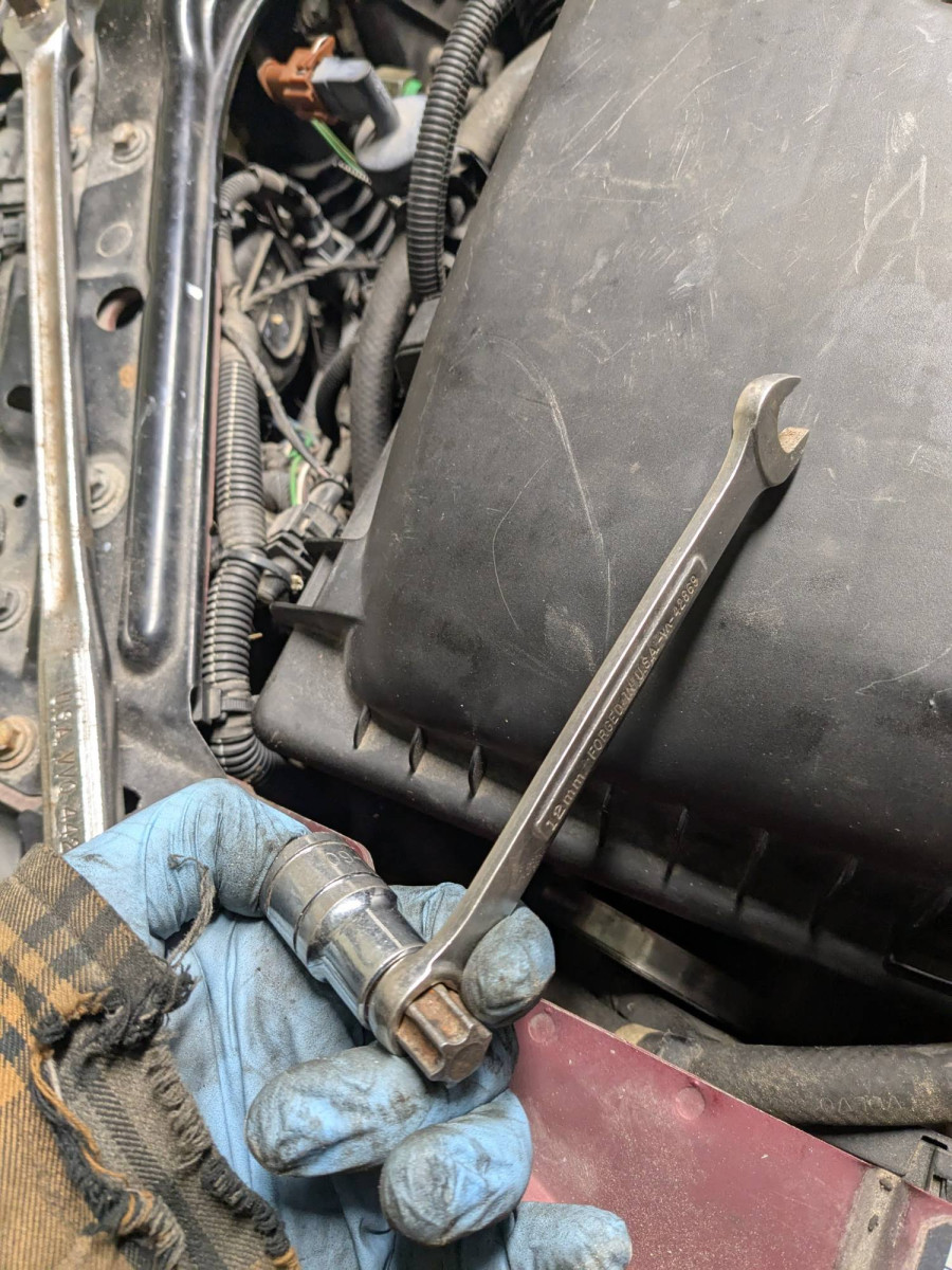 12mm wrench grabs the t60 bit nicely, but the wrench runs onto the timing cover when I try to relax the belt tensioner.