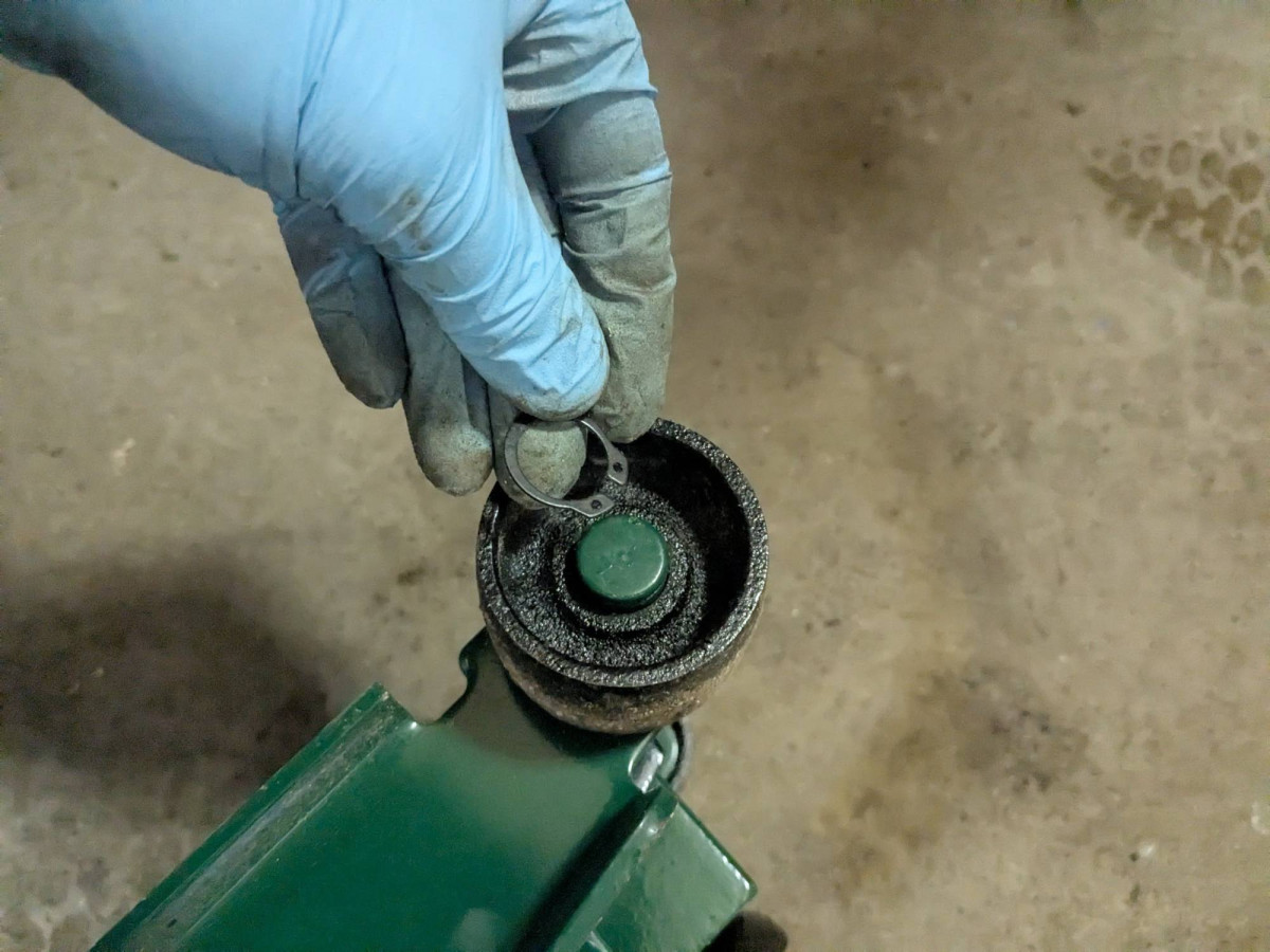 Ring popped off the floor jack wheel axle while I was hitting the rim with a mallet.