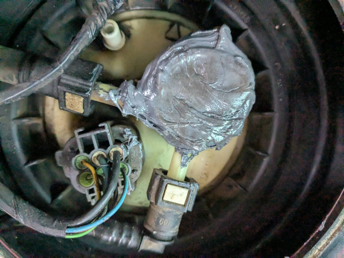 Cured epoxy plug on the top of the fuel tank after an hour of driving.