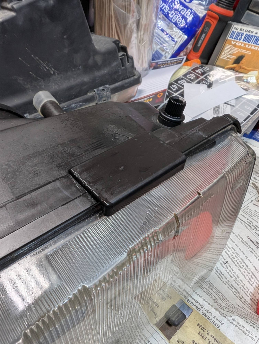 Plastic tab covering glass clip