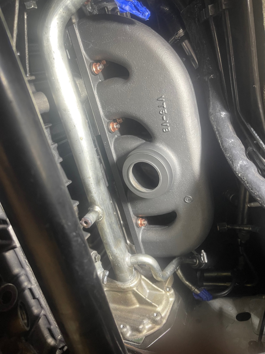 Vband Log manifold Cerakote w/Copper coated locknuts and water tree cleaned and replaced. Water ports that were used to feed the factory oil cooler are welded shut.