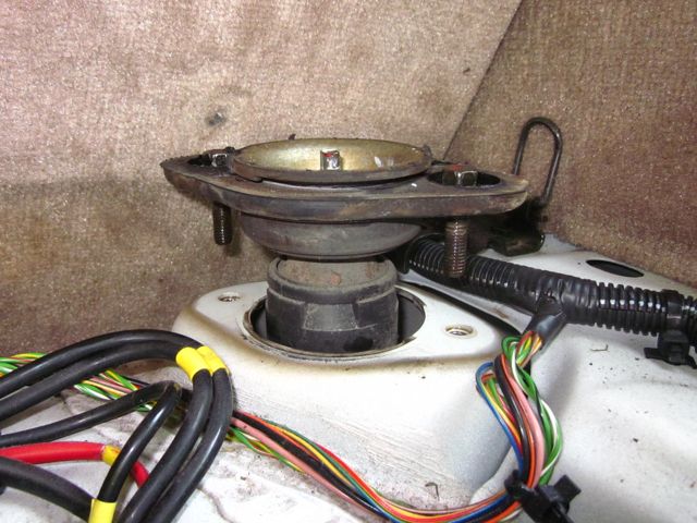 *Picture of mount lifted off of body, rusty bolts visible