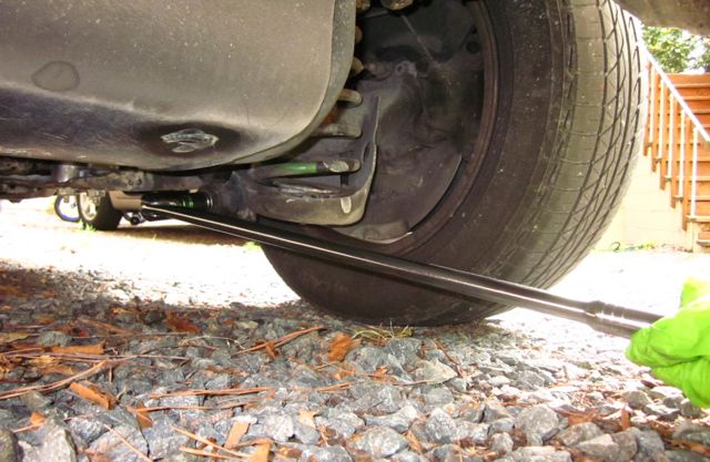 *Picture of breaker bar cracking off the torque on the bottom shock nut