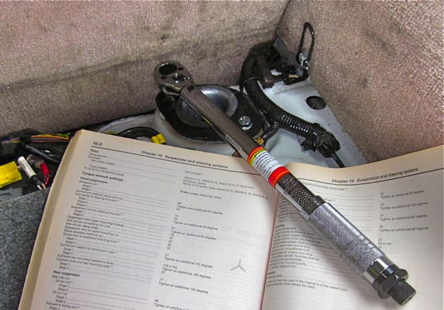 Torquing the upper mounting nuts to 18 ft-lbs.