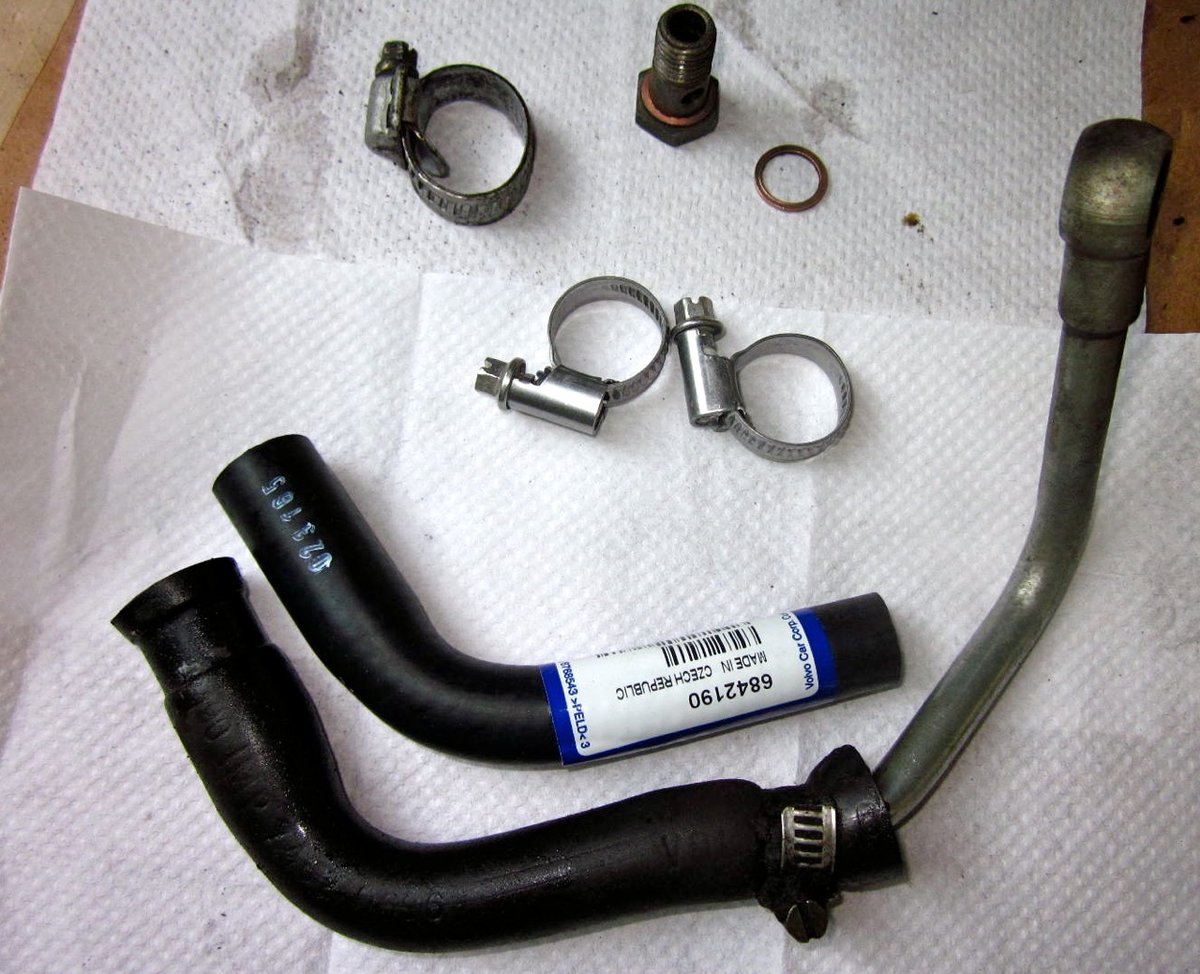 Old hose and tube, ready for swapping on the new hose and new clamps.