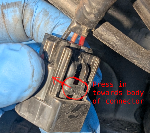 How to release the connector for the siren unit.