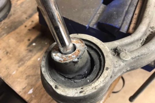 Shot rear control arm bushing