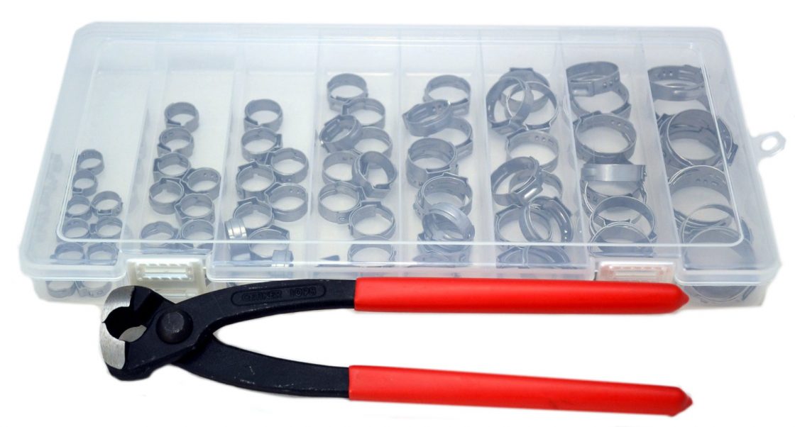 Oetiker - tool with red grips under a box of Oetiker clamps
